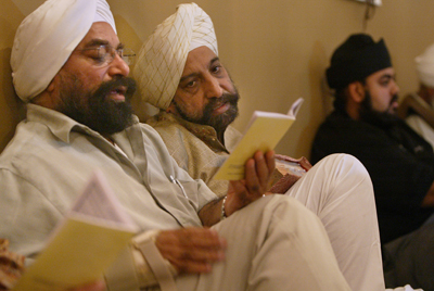 Jas Singh of New York City, left, and Gurbakht Singh Gulati of Toronto, right, attend worship at the Gobind Sadan Temple in Palermo, N.Y. Religion News Service photo by Li-Hua Lan/The Post- Standard in Syracuse, N.Y. 