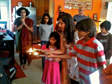 Mudita Bahadur performs an offering with her children, Nadeen, 11, and Nikita, 9, before the Bal Kendra group breaks for social hour. RNS photo courtesy Santa Monica Bal Kendra 