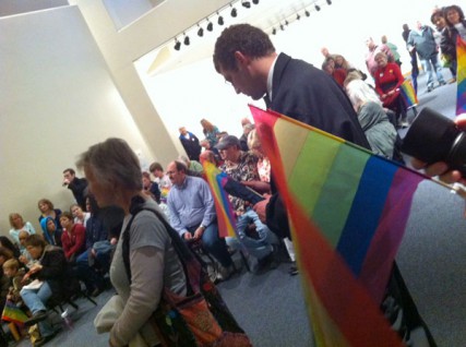 Photo of people waiting to speak at a City Council meeting 