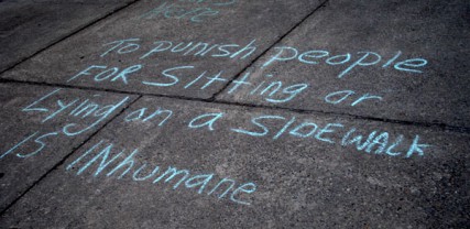 Chalk message outside of City Hall protesting panhandling ordinance. 