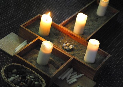 A cross with candles sits in the center of the Lutheran Campus Ministry gathering. 