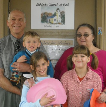 Pastor AJ Donier (left) and his wife Jennine (right) with youth from Eklesia Church of God. 