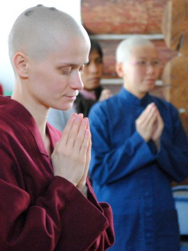 Ven. Thubten Jampa prays during her ordination ceremony. 