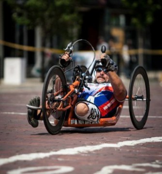 Tom Davis, pictured here on his bike, is an Iraq War veteran who lost his leg when an improvised explosive device went off during a night patrol. 