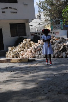 A Haitian girl attends church after the 2010 earthquake. 