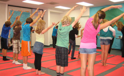 Children practice yoga at El Camino Creek Elementary School in Carlsbad, Calif. 