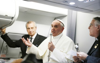 Pope Francis addresses journalists on his flight from Rio de Janeiro to Rome July 29. The pope spent 80 minutes answering questions from 21 journalists on the plane.  