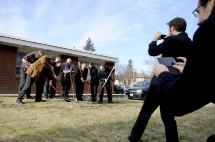 Folks scramble for pictures of the groundbreaking of the Peaceful Valley Youth Center at All Saints Lutheran Church in Browne’s Addition on Friday. Kathy Plonka photo