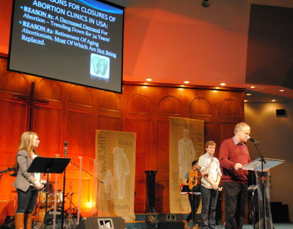 Pastor Tim White delivers a "pro-life report" at a Walk for Life Rally in Spokane