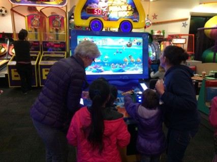 A family takes homeless children to Chuck-E-Cheese. Contributed Photo