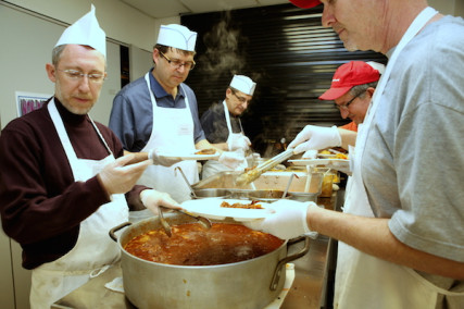 Volunteers prepare food at the Kosher Dinner