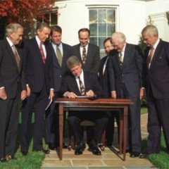 (RNS1-JUNE 24) President Bill Clinton signs the Religious Freedom Restoration Act at the White House's South Lawn on Nov. 16, 1993. For use with RNS-RFRA transmitted June 24, 2014. Public domain photo via the The U.S. National Archives