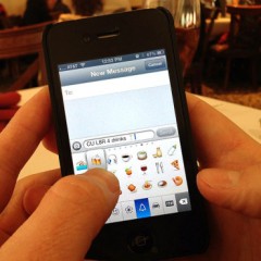 (RNS1-JULY 11) A man adds an emoji character to the end of his text message. For use with RNS-EMOJI-KEYBOARD transmitted July 11, 2014. Creative Commons image by Intel Free Press