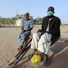 (RNS1-jan22) An injured man and woman who were displaced as a result of Boko Haram attacks in the northeast region of Nigeria, sit on a bench at a camp for internally displaced persons (IDP) in Yola, Adamawa State on January 13, 2015. For use only with RNS-BOKO-HARAM, transmitted on January 22, 2015, Photo courtesy of REUTERS/Afolabi Sotunde.