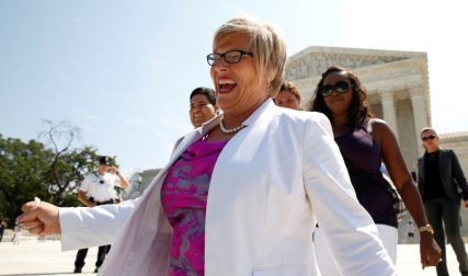 Lead plaintiff Amy Hagstrom-Miller, president and CEO of Whole Woman's Health, smiles as she walks from the U.S. Supreme Court after the court handed a victory to abortion rights advocates, striking down a Texas law imposing strict regulations on abortion doctors and facilities in Washington June 27, 2016. REUTERS/Kevin Lamarque